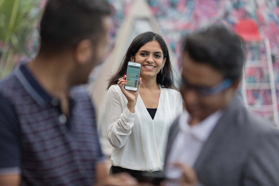 woman-holding-up-mobile-smart-phone