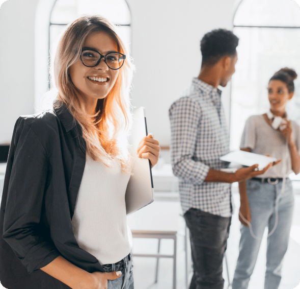 elegant-business-lady-trendy-black-jacket-holding-laptop-smiling-portrait-cheerful-blonde-secretary-tall-african-office-worker 1